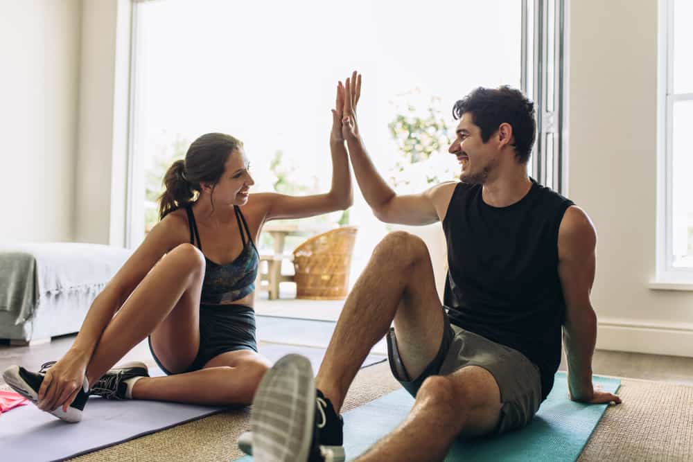 Couple exercising together as their couple morning routine