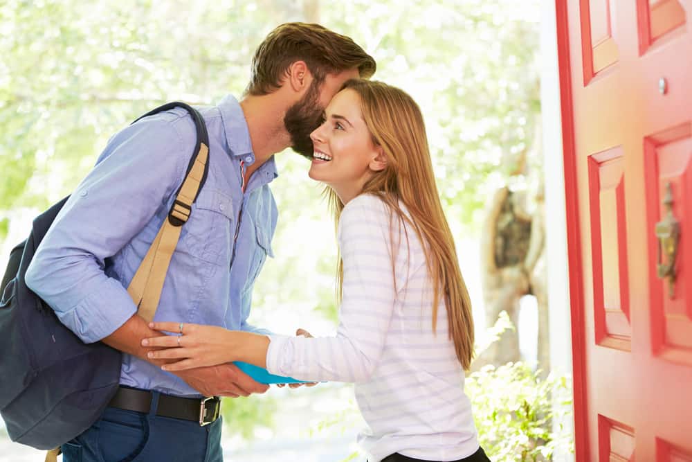 Couple saying goodbye at the door