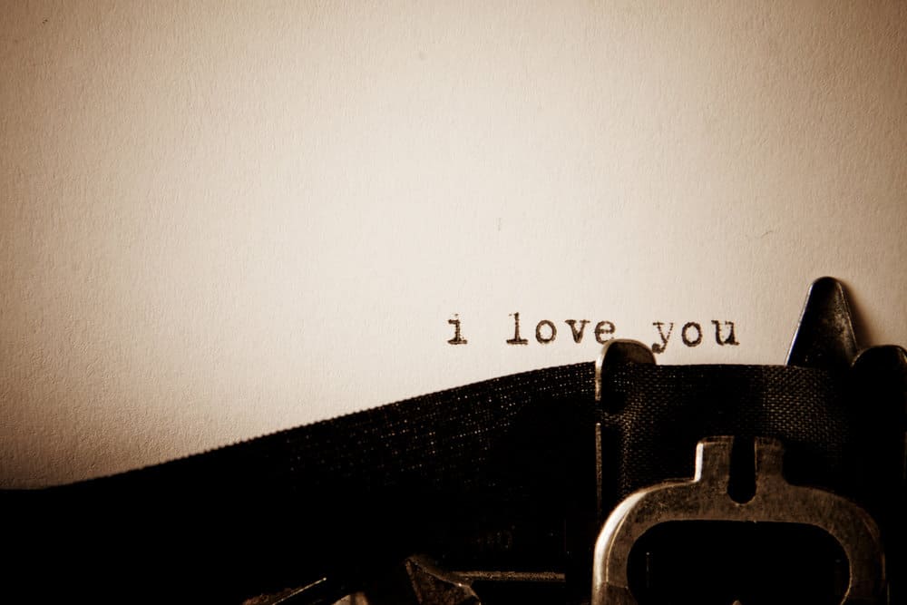 A typewriter has typed out "i love you" in love letters for him