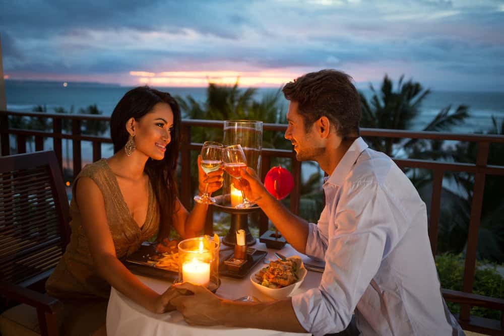 A couple at dinner surpassing a marriage proposal