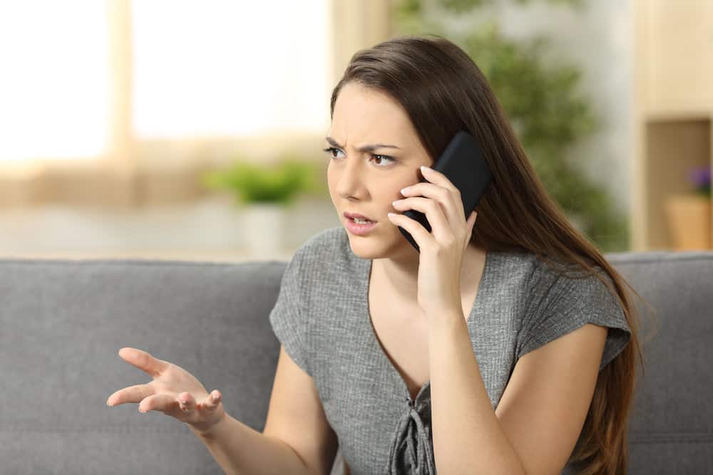 A narcisstic woman is upset on the phone