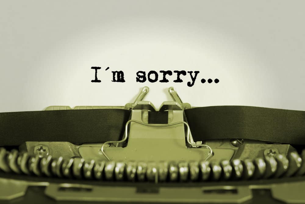 "I'm sorry" is typed out on a typewriter.